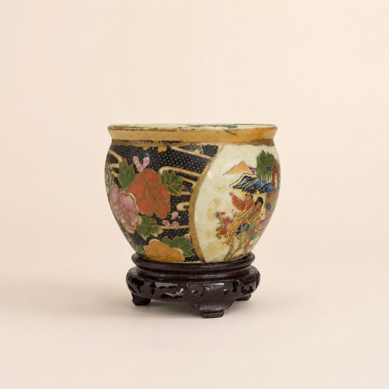 Small Satsuma-style planter with dark wood stand on an ivory studio background