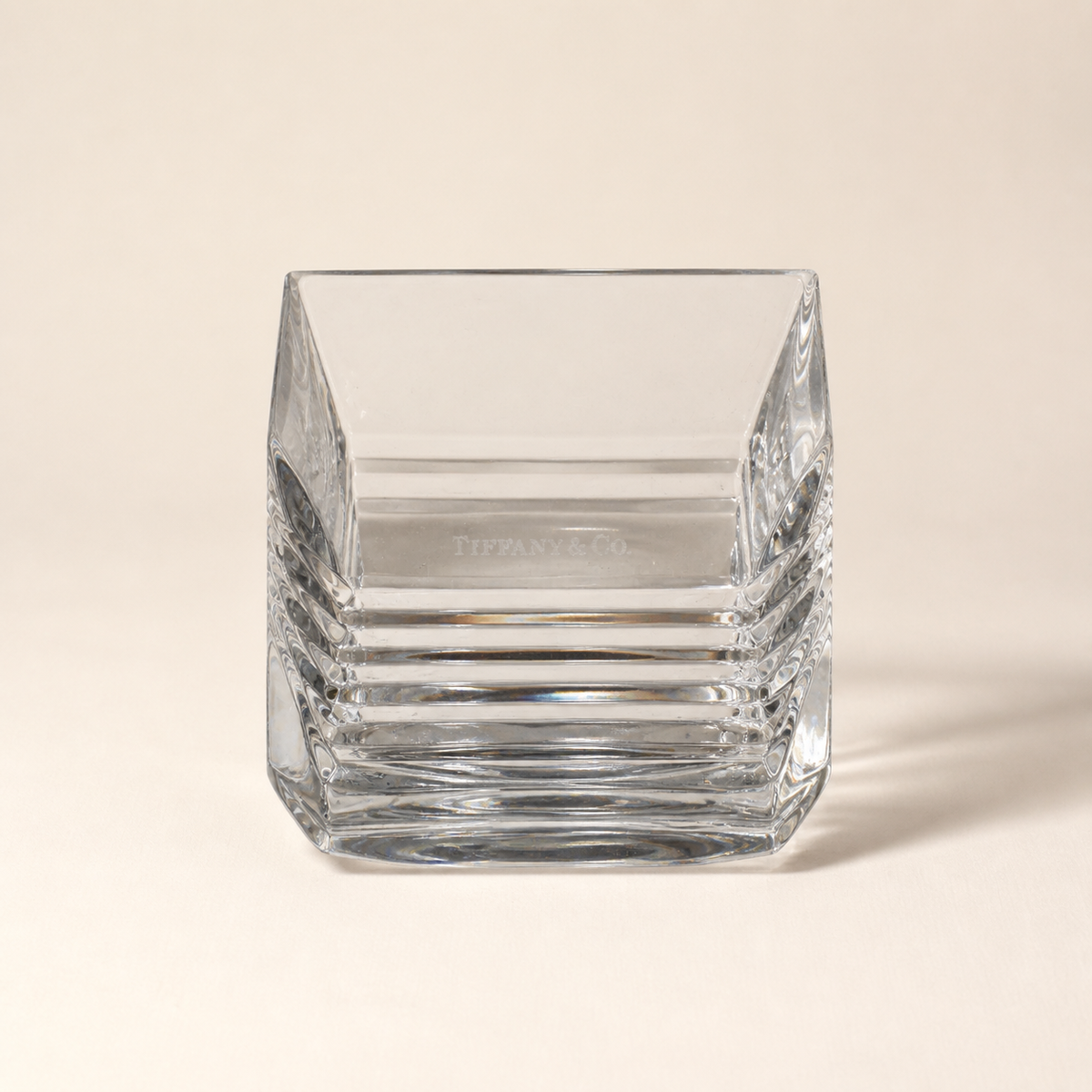 Tiffany and Co. crystal square dish on an ivory studio background