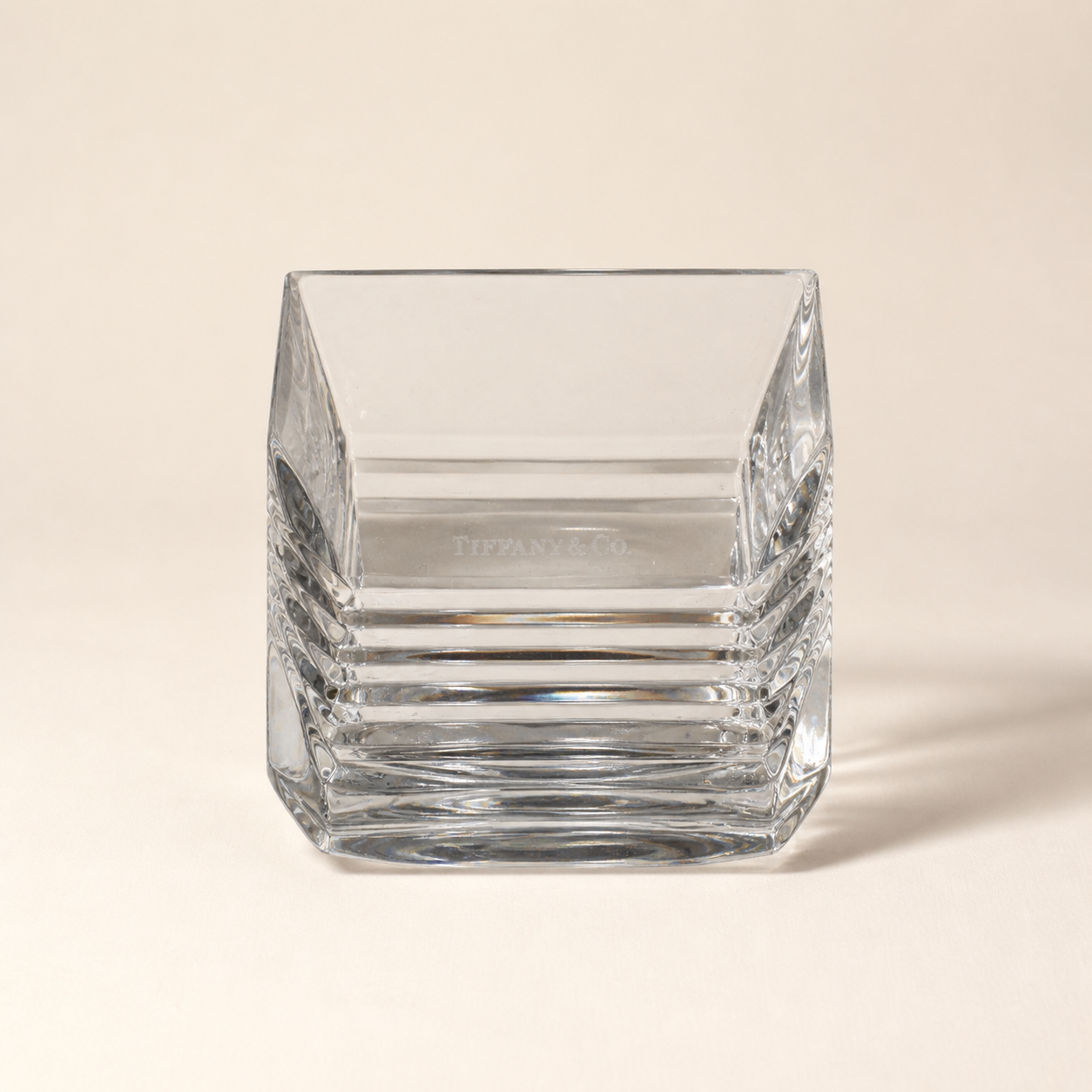 Tiffany and Co. crystal square dish on an ivory studio background